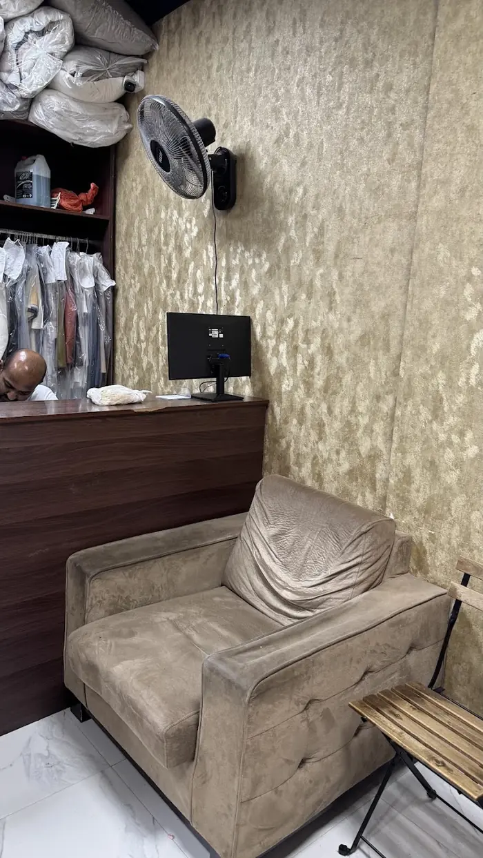 Reception counter and waiting chair inside the shop
